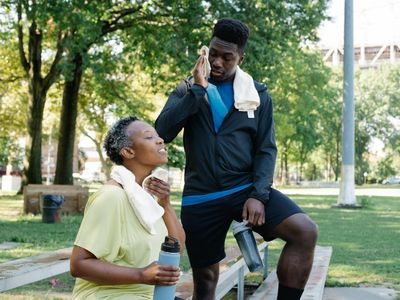 Water bottle and towel on a bench